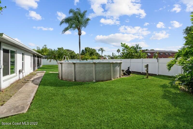 711 Montclair Road Northeast Palm Bay, FL 32905 - Photo 33 of 35 a view of a garden with a slide