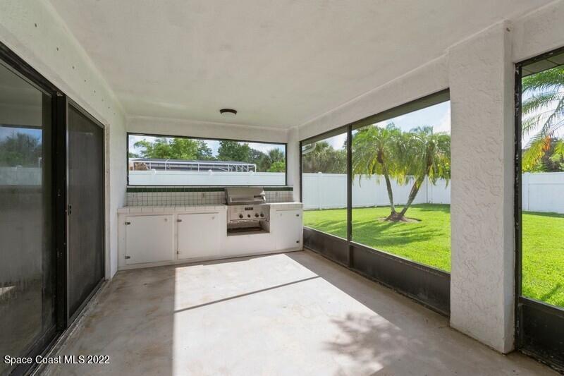 711 Montclair Road Northeast Palm Bay, FL 32905 - Photo 34 of 35 a kitchen with a large window