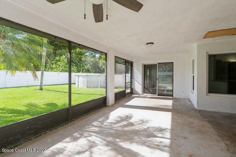 711 Montclair Road Northeast Palm Bay, FL 32905 - Photo 35 of 35 a view of an entryway with a garden