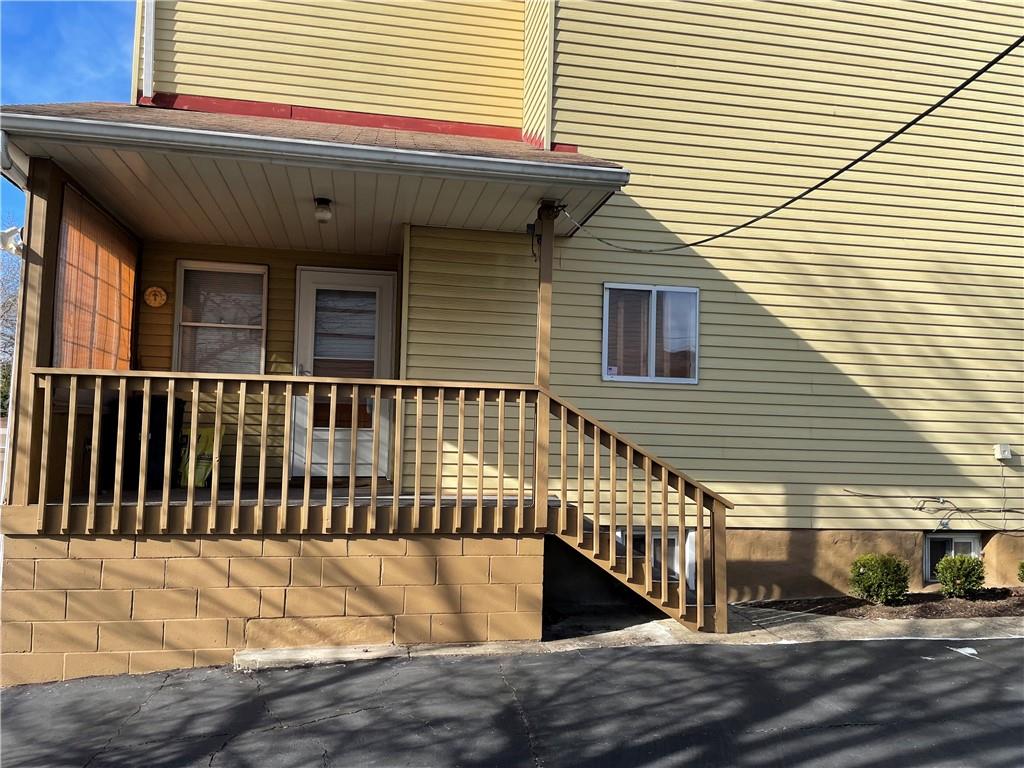 831 Railroad Street McKees Rocks, PA 15136 - Photo 3 of 16 a view of a house with wooden deck