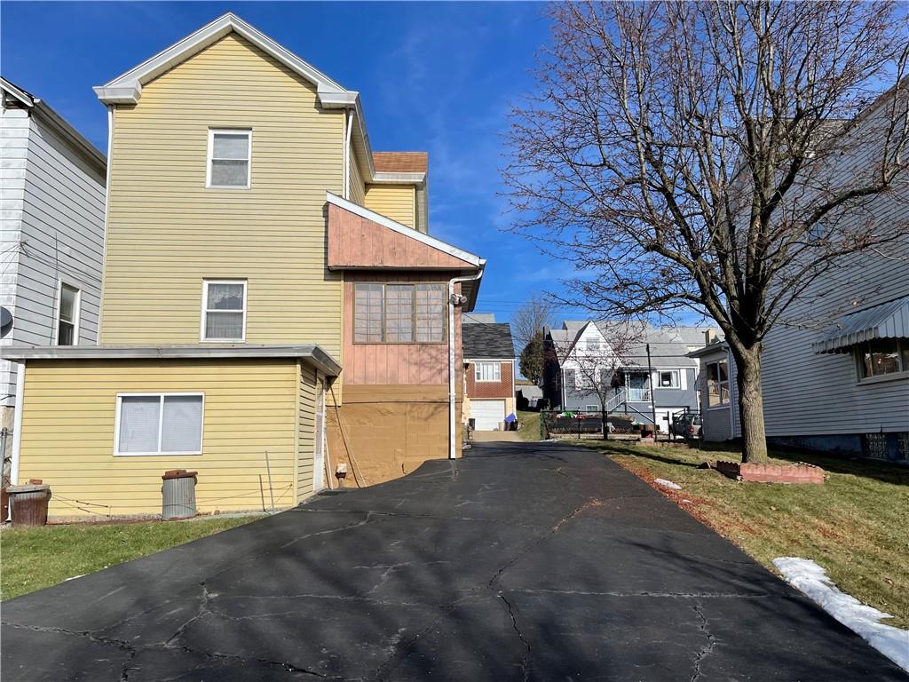 831 Railroad Street McKees Rocks, PA 15136 - Photo 4 of 16 a view of a house with a yard