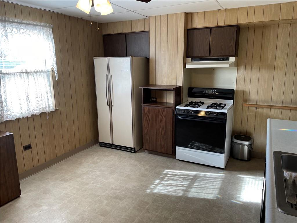 831 Railroad Street McKees Rocks, PA 15136 - Photo 6 of 16 a kitchen with a refrigerator stove and a sink