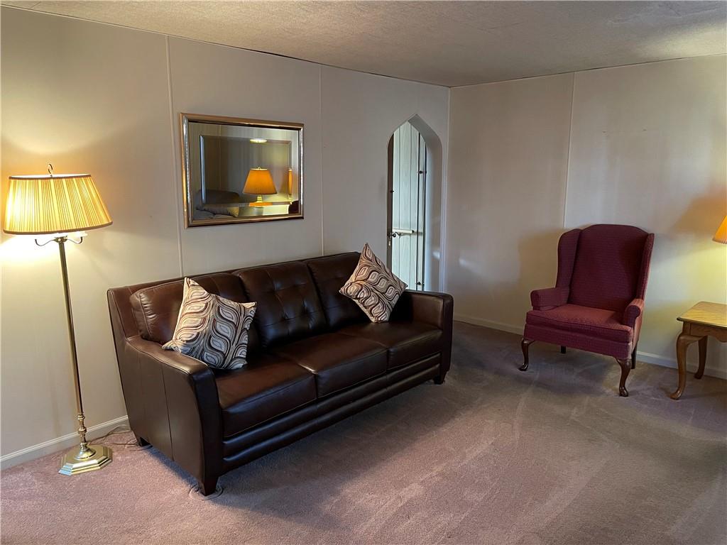 831 Railroad Street McKees Rocks, PA 15136 - Photo 8 of 16 a living room with furniture and a painting
