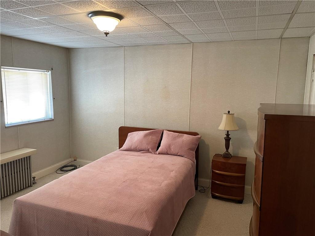 831 Railroad Street McKees Rocks, PA 15136 - Photo 10 of 16 a bedroom with a bed and a window