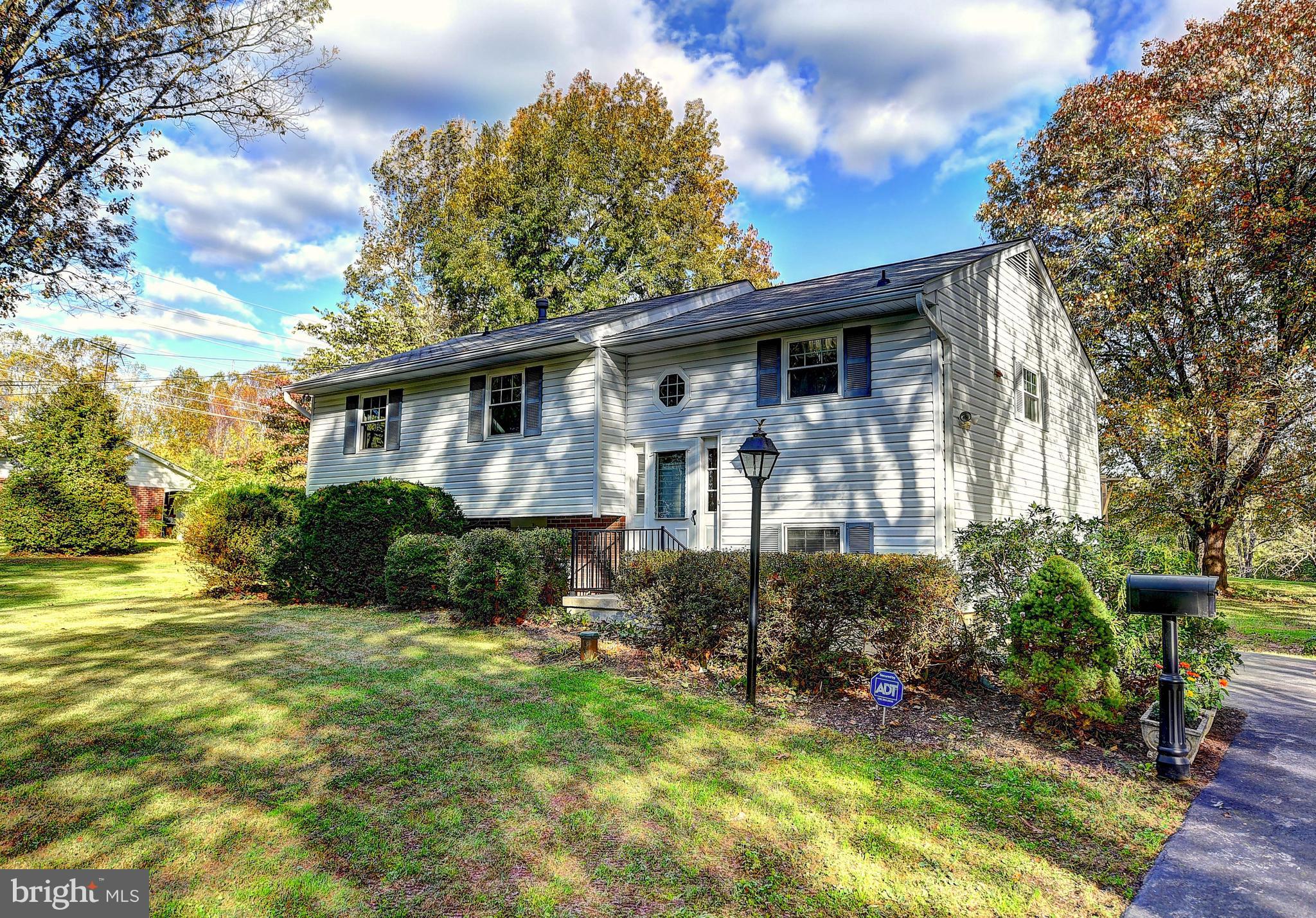 9200 Dogwood Road Baltimore, MD 21244 - Photo 1 of 25 a view of a house with backyard and sitting area