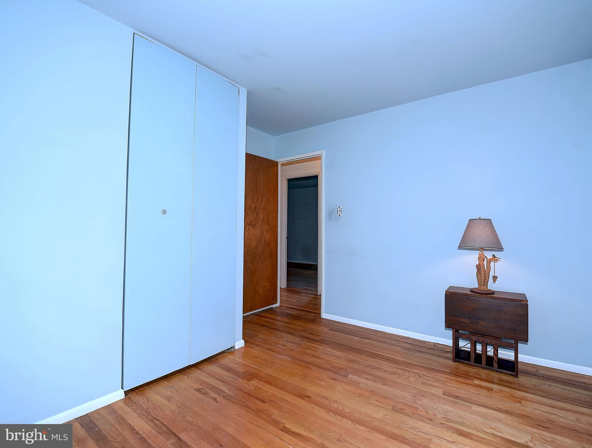 9200 Dogwood Road Baltimore, MD 21244 - Photo 12 of 25 a view of room with hardwood floor and lounge chair