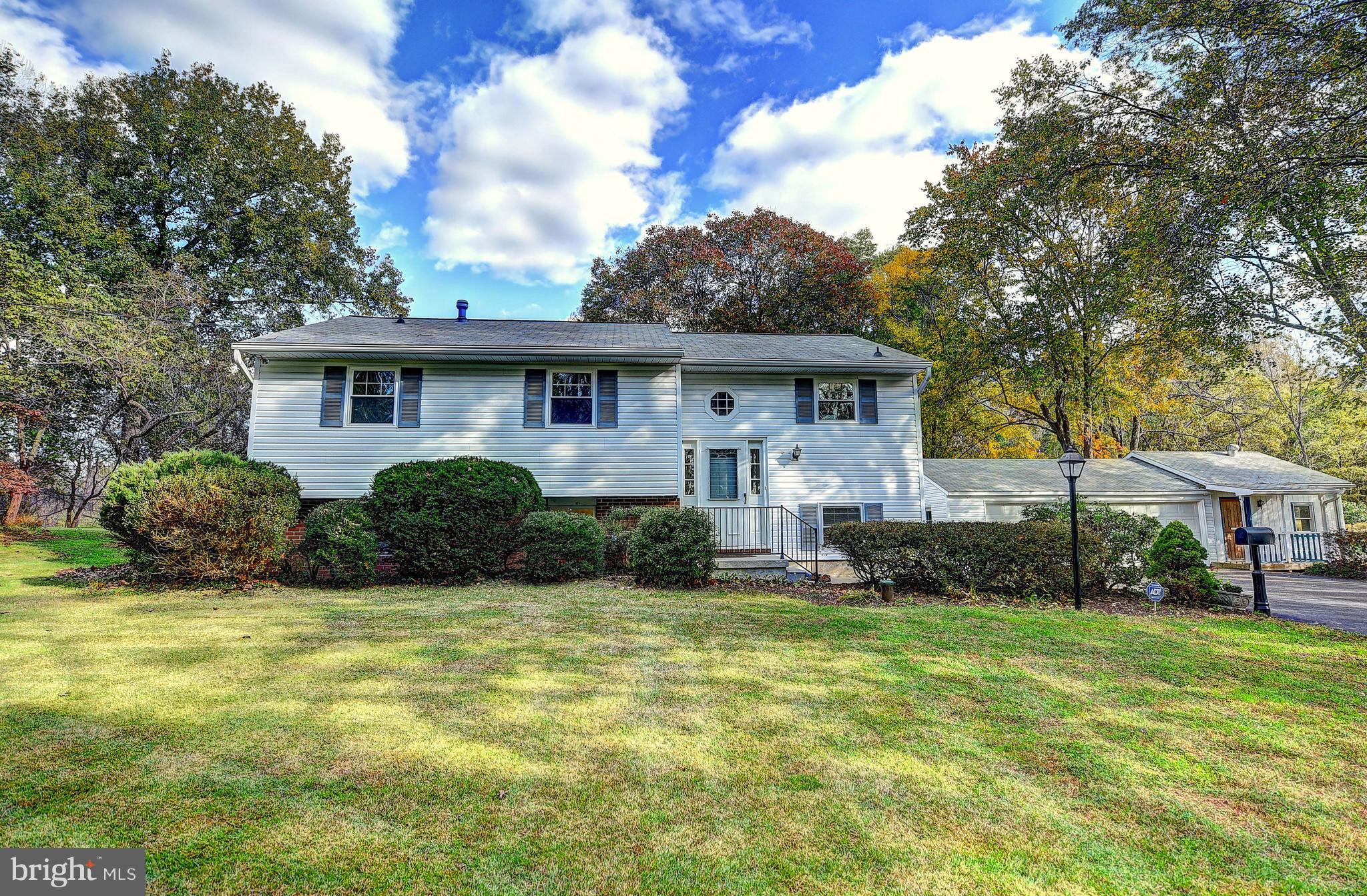 9200 Dogwood Road Baltimore, MD 21244 - Photo 3 of 25 a view of an house with backyard and trees