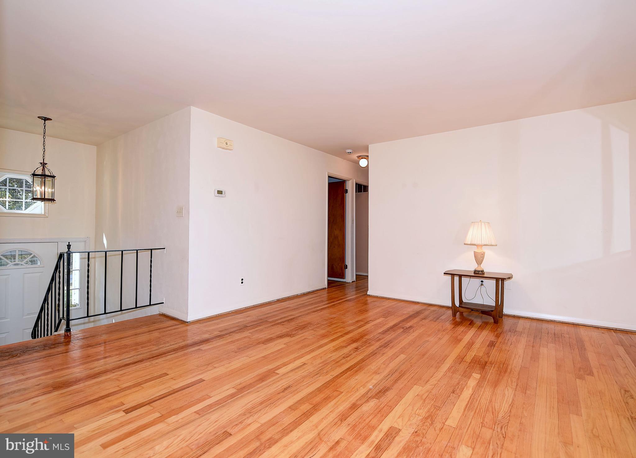 9200 Dogwood Road Baltimore, MD 21244 - Photo 7 of 25 a view of an empty room with wooden floor
