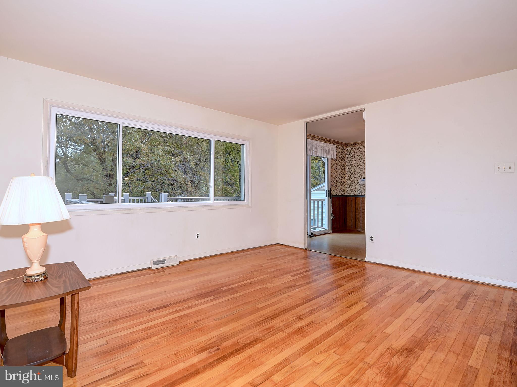 9200 Dogwood Road Baltimore, MD 21244 - Photo 8 of 25 a view of empty room with wooden floor and fan
