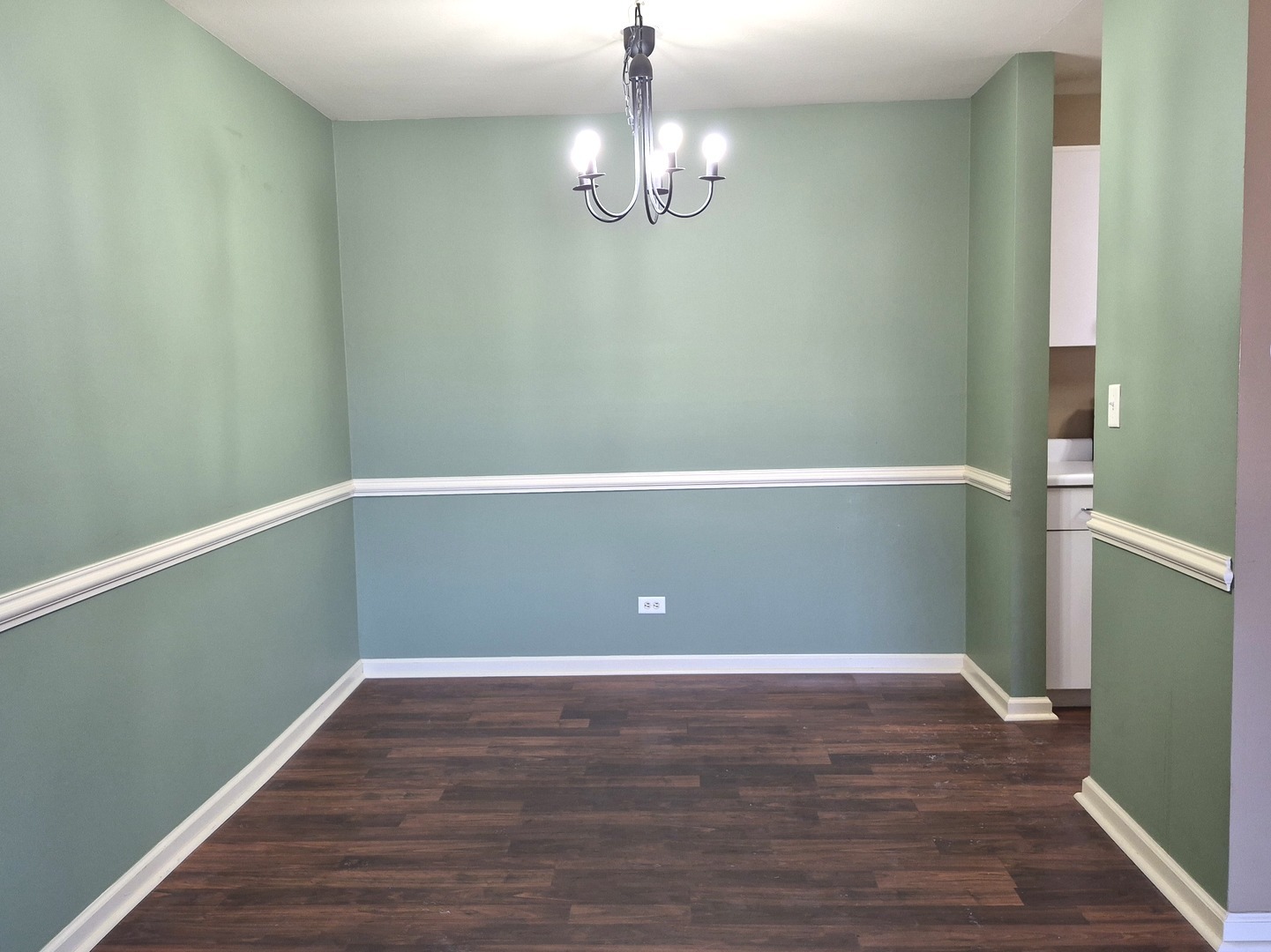 1117 South Old Wilke Road, Unit 206 Arlington Heights, IL 60005 - Photo 4 of 9 a view of empty room with wooden floor