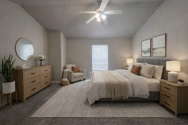 a bedroom with bed and a chandelier