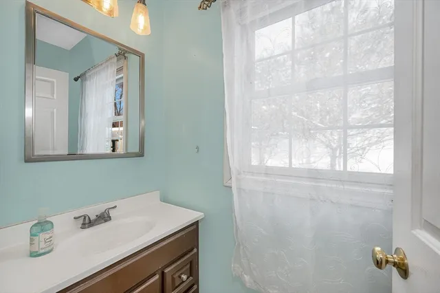 a bedroom with bed and window