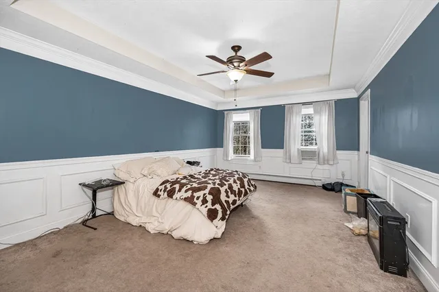 a bedroom with bed and window