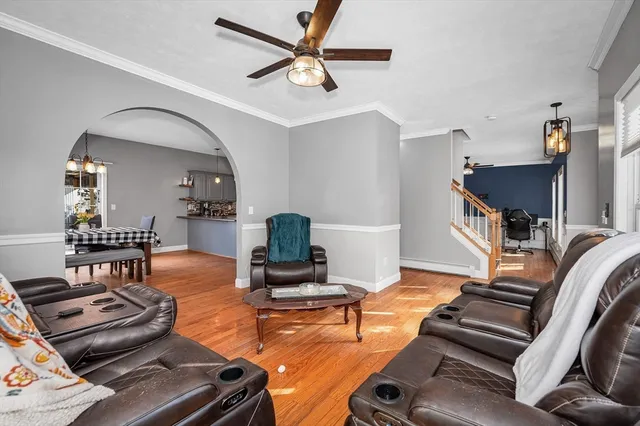 a view of a dining room with furniture window and wooden floor