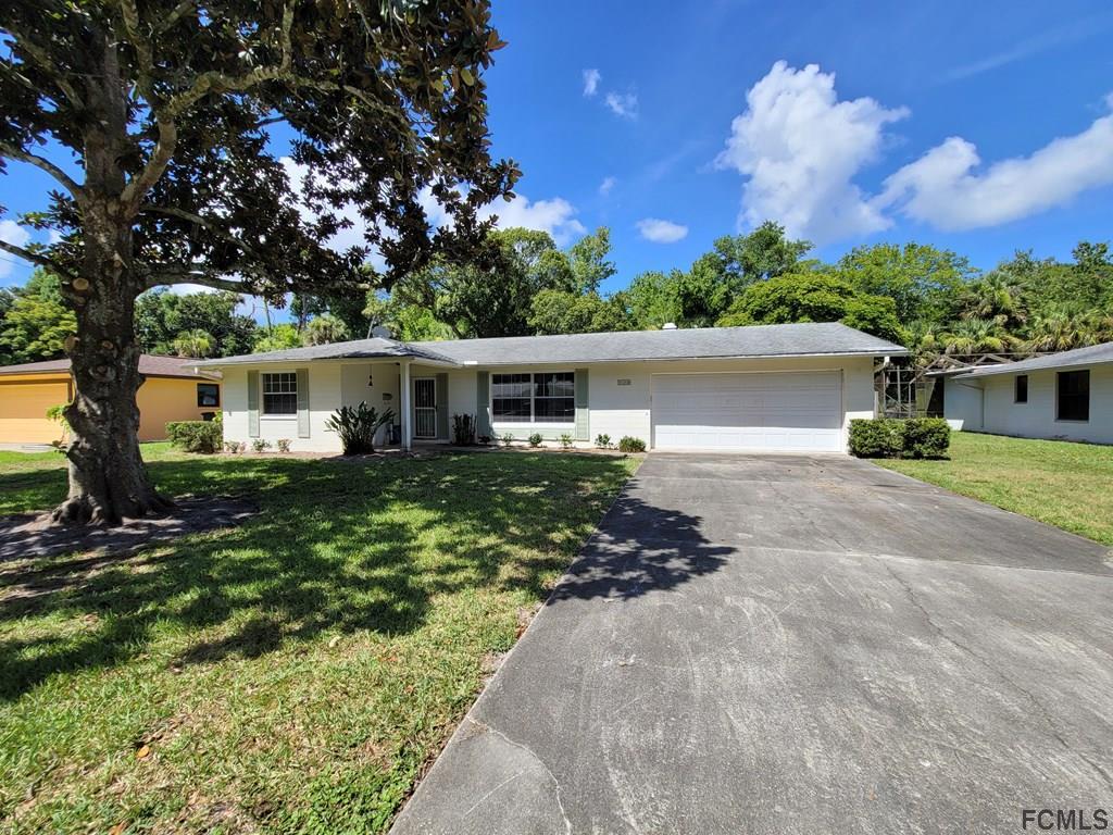 736 Lindenwood Circle Ormond Beach, FL 32174 - Photo 1 of 56 front view of a house with a yard