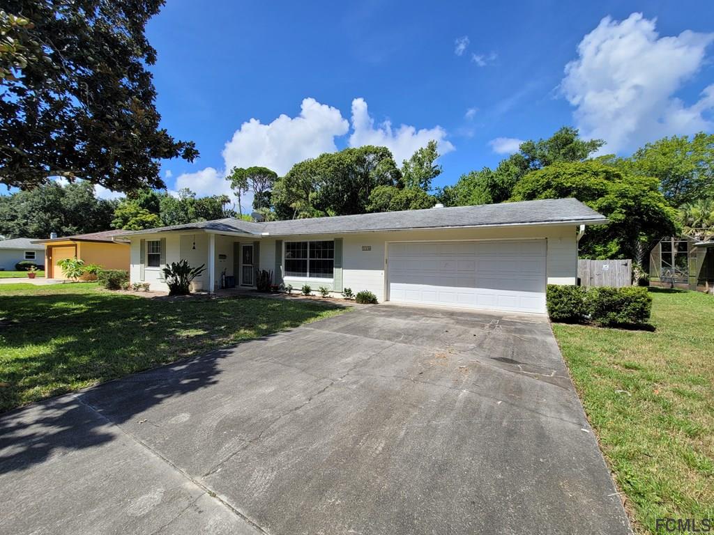 736 Lindenwood Circle Ormond Beach, FL 32174 - Photo 3 of 56 a front view of house with yard and green space