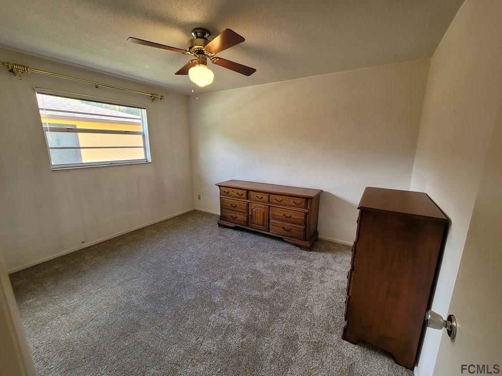 736 Lindenwood Circle Ormond Beach, FL 32174 - Photo 35 of 56 a view of an empty room with a window