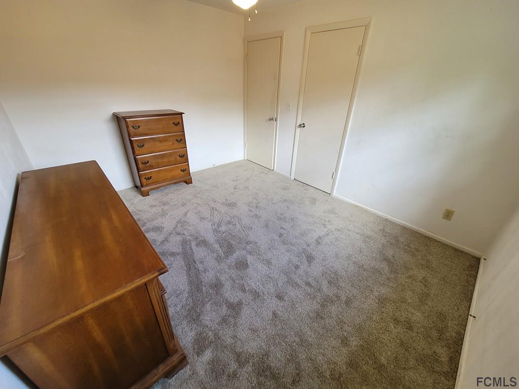 736 Lindenwood Circle Ormond Beach, FL 32174 - Photo 38 of 56 a room with a bed