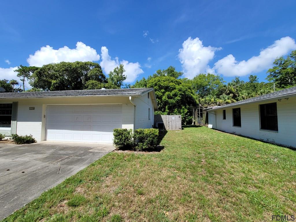 736 Lindenwood Circle Ormond Beach, FL 32174 - Photo 4 of 56 a house view with a garden space