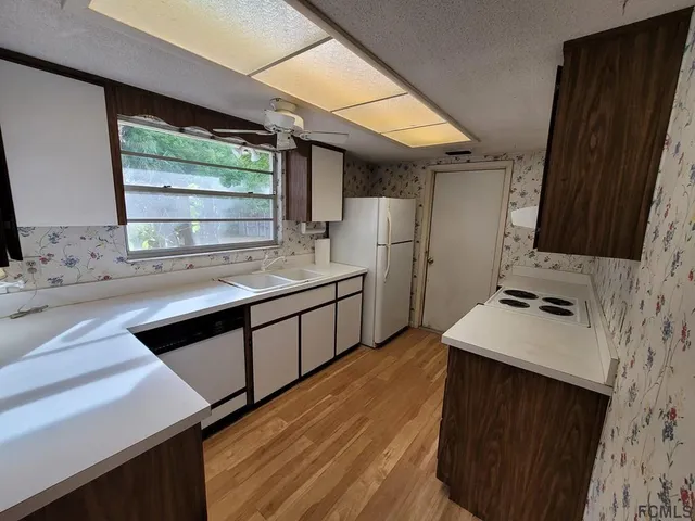 a backyard of a house with lots of green space