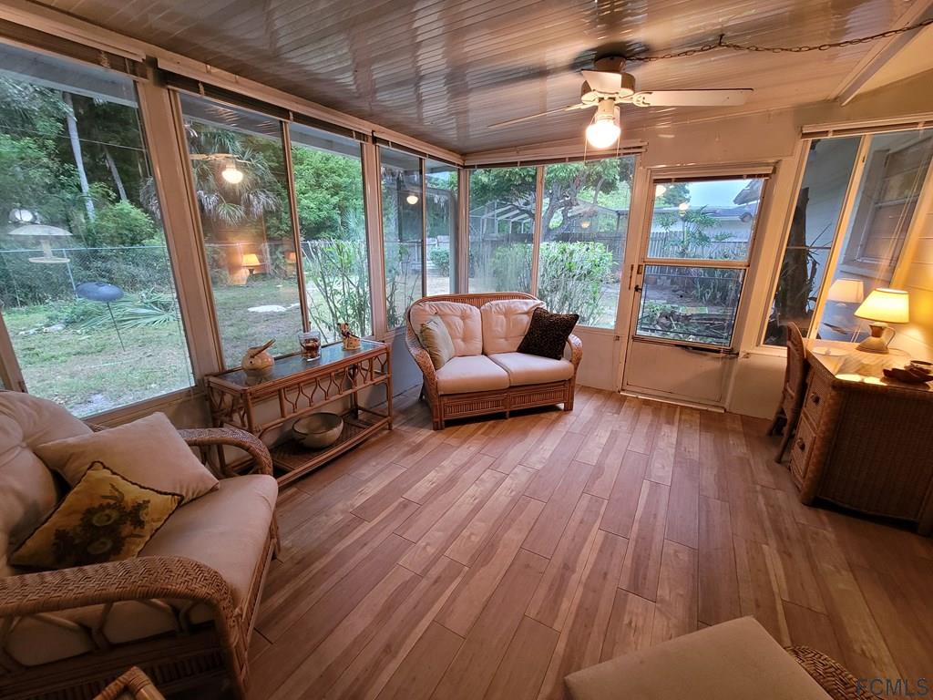 736 Lindenwood Circle Ormond Beach, FL 32174 - Photo 47 of 56 a living room with furniture and a large window