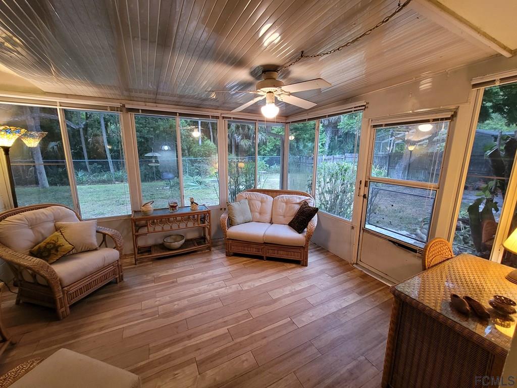 736 Lindenwood Circle Ormond Beach, FL 32174 - Photo 49 of 56 a living room with furniture and a large window