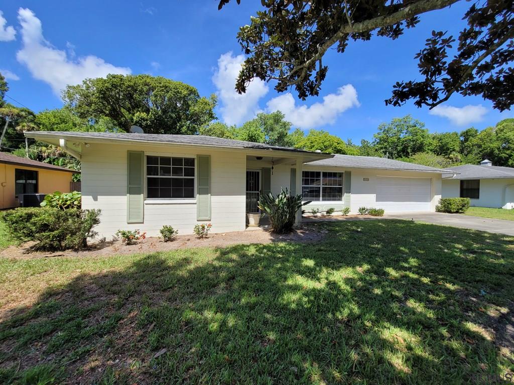 736 Lindenwood Circle Ormond Beach, FL 32174 - Photo 5 of 56 a front view of house with yard and green space