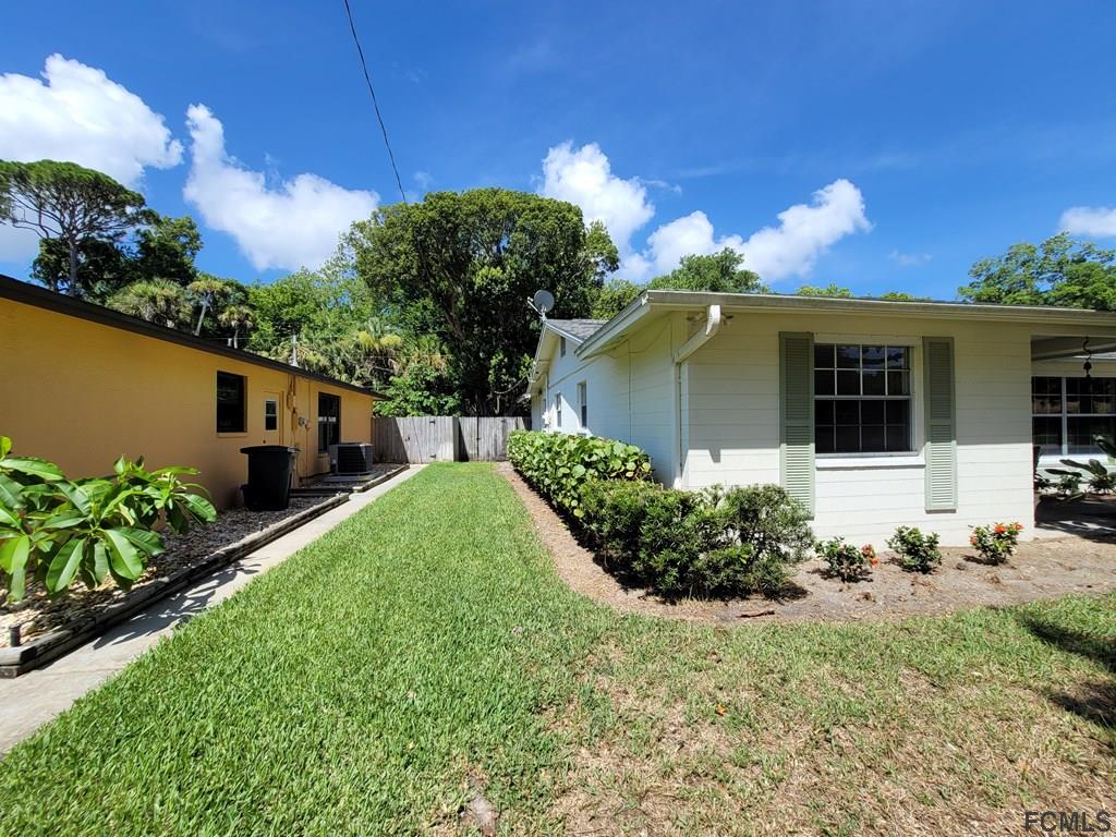 736 Lindenwood Circle Ormond Beach, FL 32174 - Photo 6 of 56 a front view of a house with garden