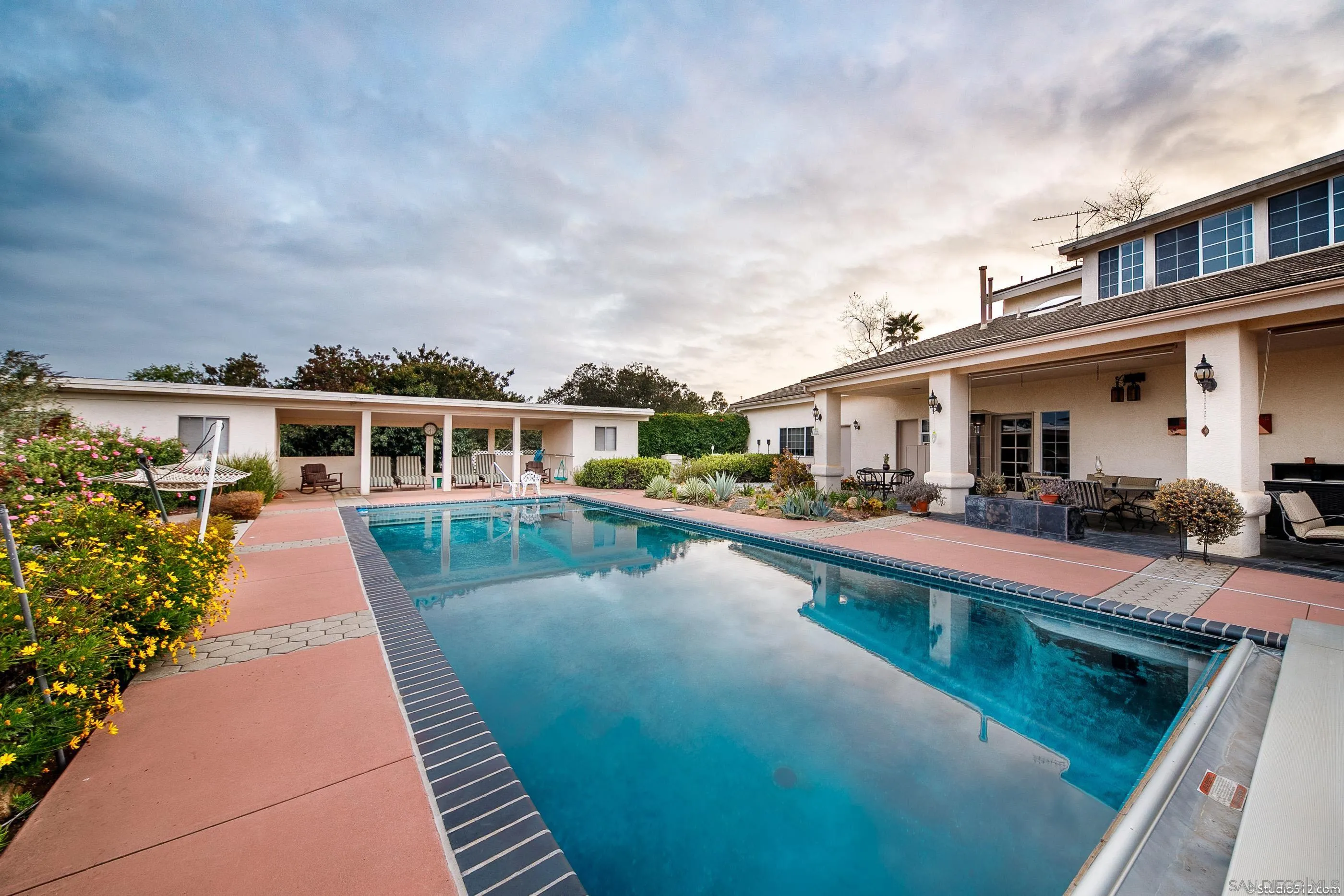 a view of a house with swimming pool
