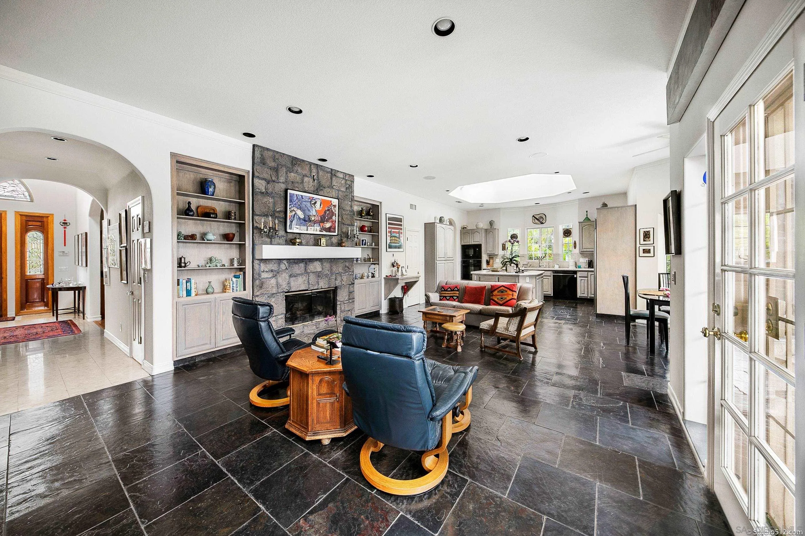 28398 Alamar Road Valley Center, CA 92082 - Photo 12 of 41 a living room with furniture a fireplace and a flat screen tv