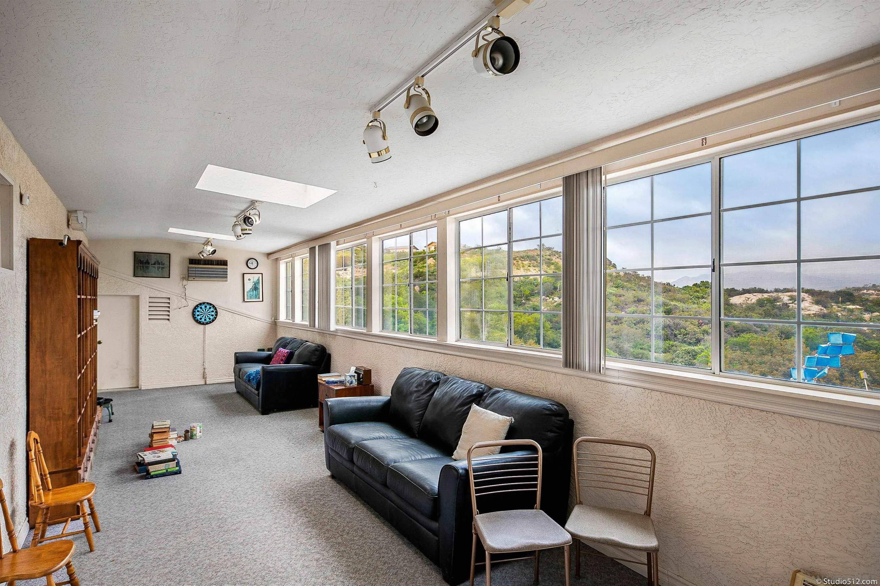 28398 Alamar Road Valley Center, CA 92082 - Photo 18 of 41 a living room with furniture and a large window