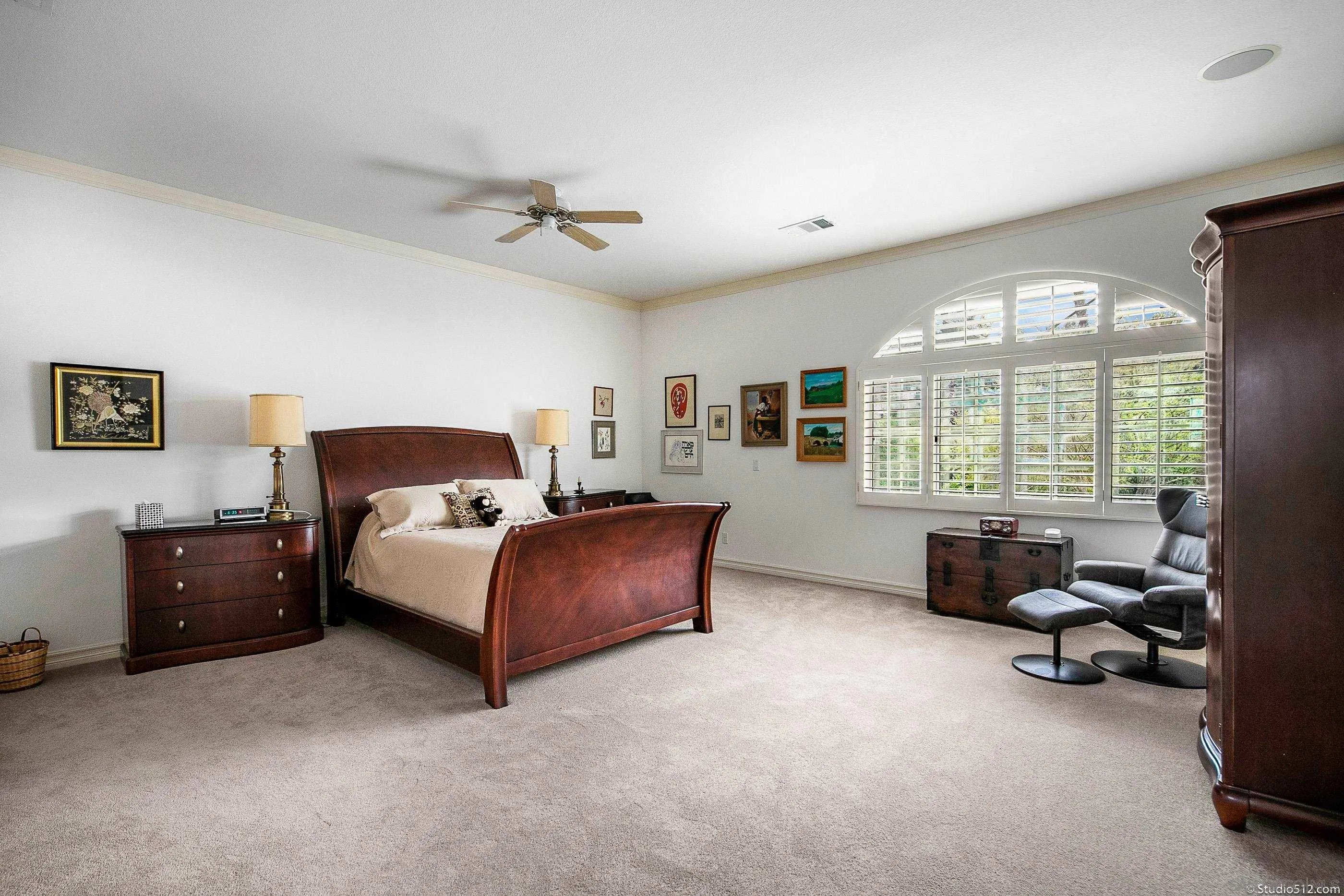 28398 Alamar Road Valley Center, CA 92082 - Photo 19 of 41 a bedroom with a bed and a couch