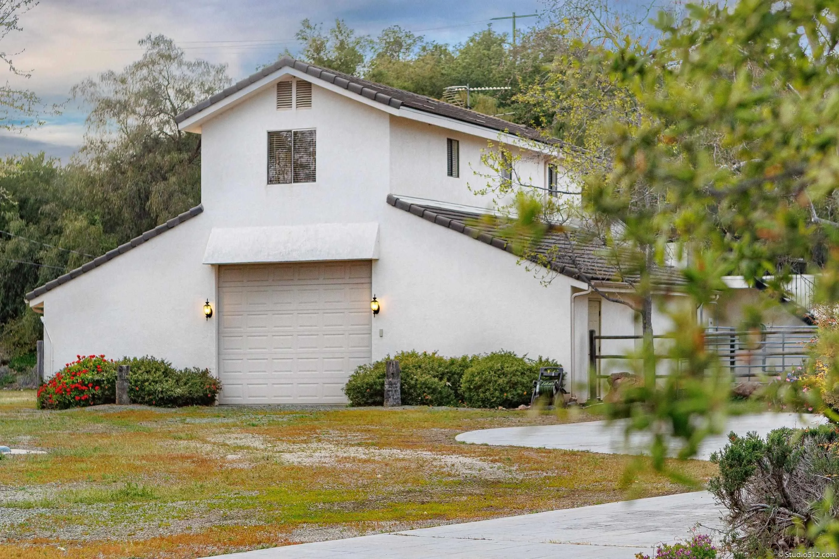 28398 Alamar Road Valley Center, CA 92082 - Photo 23 of 41 a view of a house with a yard and garage