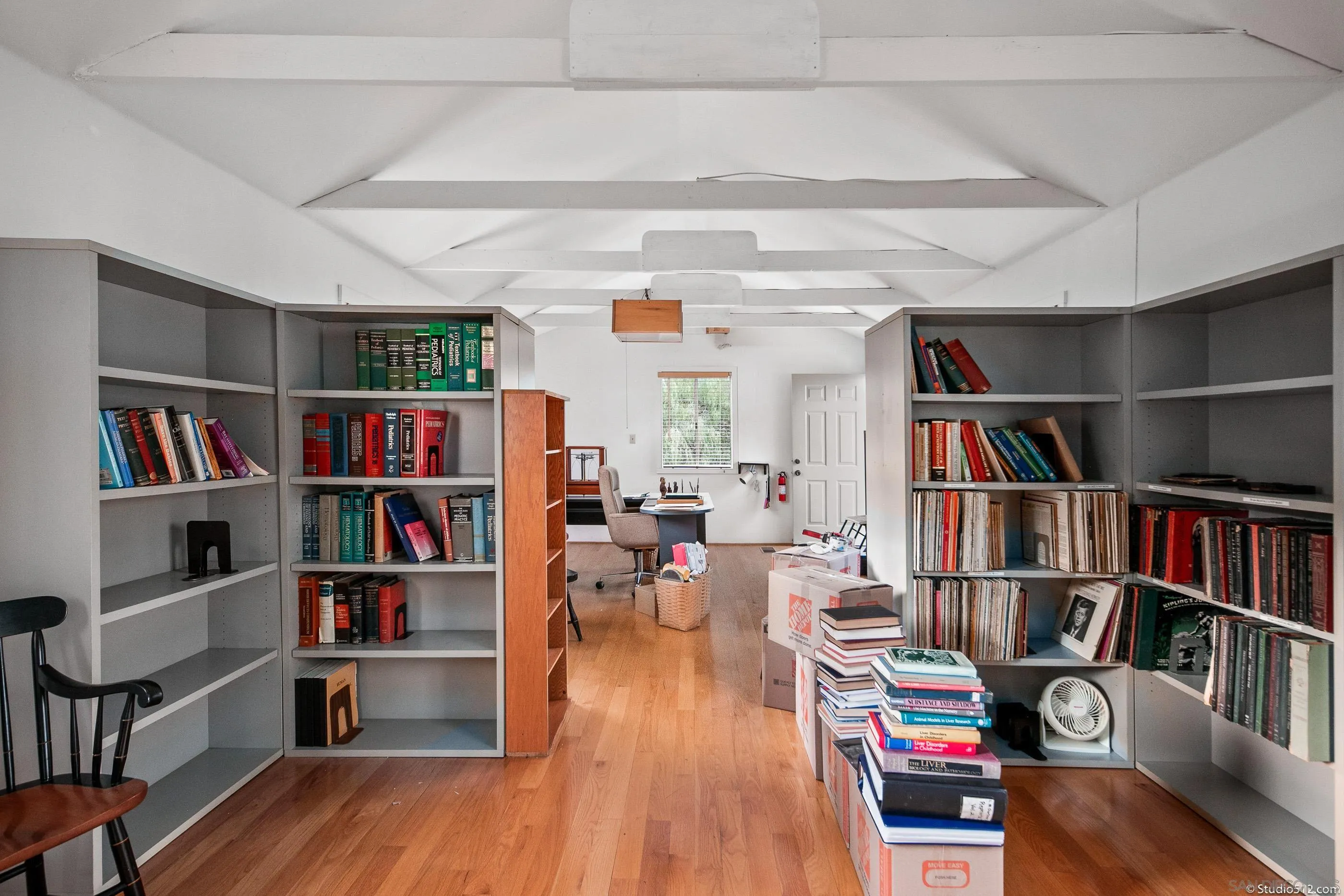 28398 Alamar Road Valley Center, CA 92082 - Photo 27 of 41 a living room with furniture and a book shelf