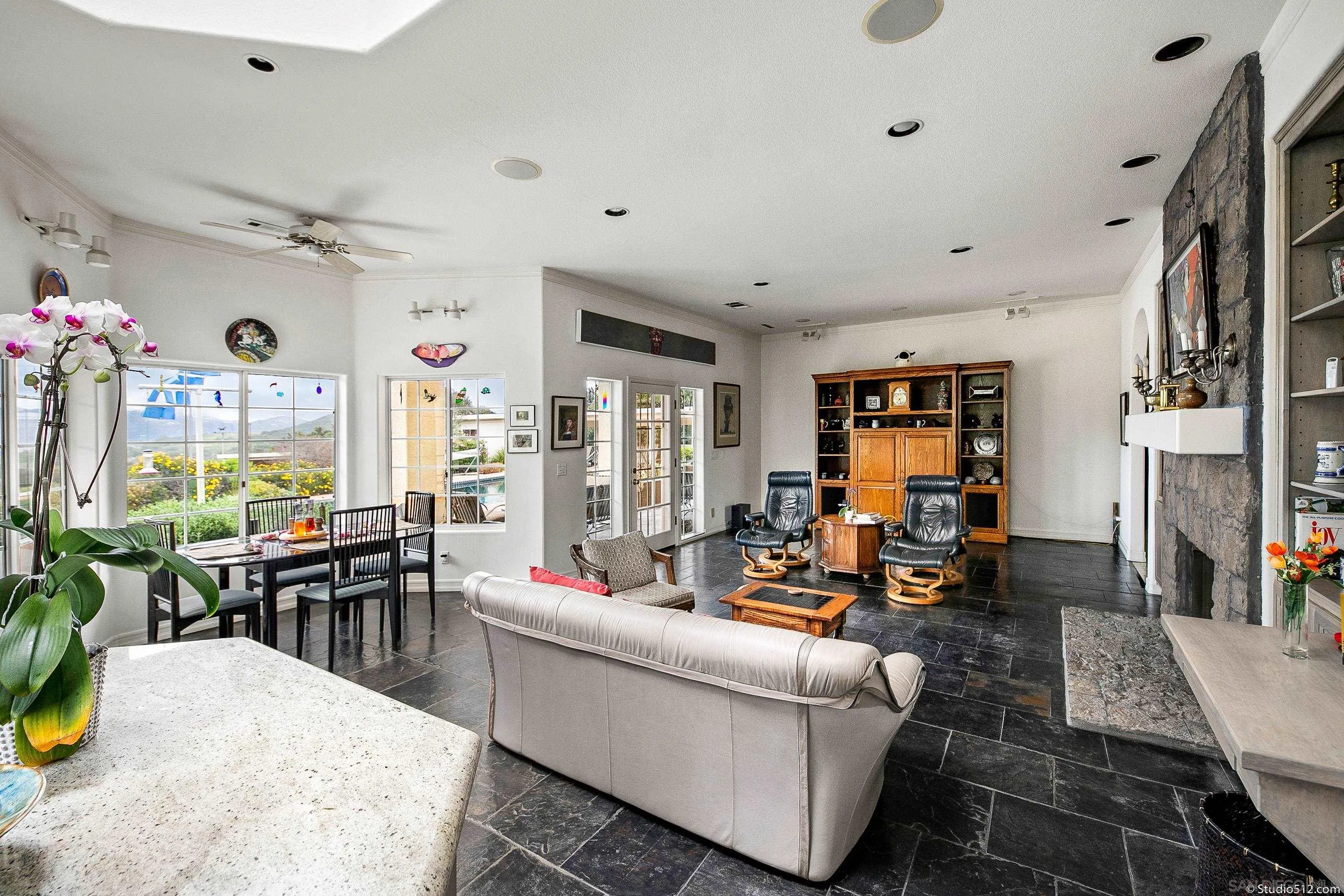 28398 Alamar Road Valley Center, CA 92082 - Photo 10 of 41 a living room with fireplace furniture and a large window