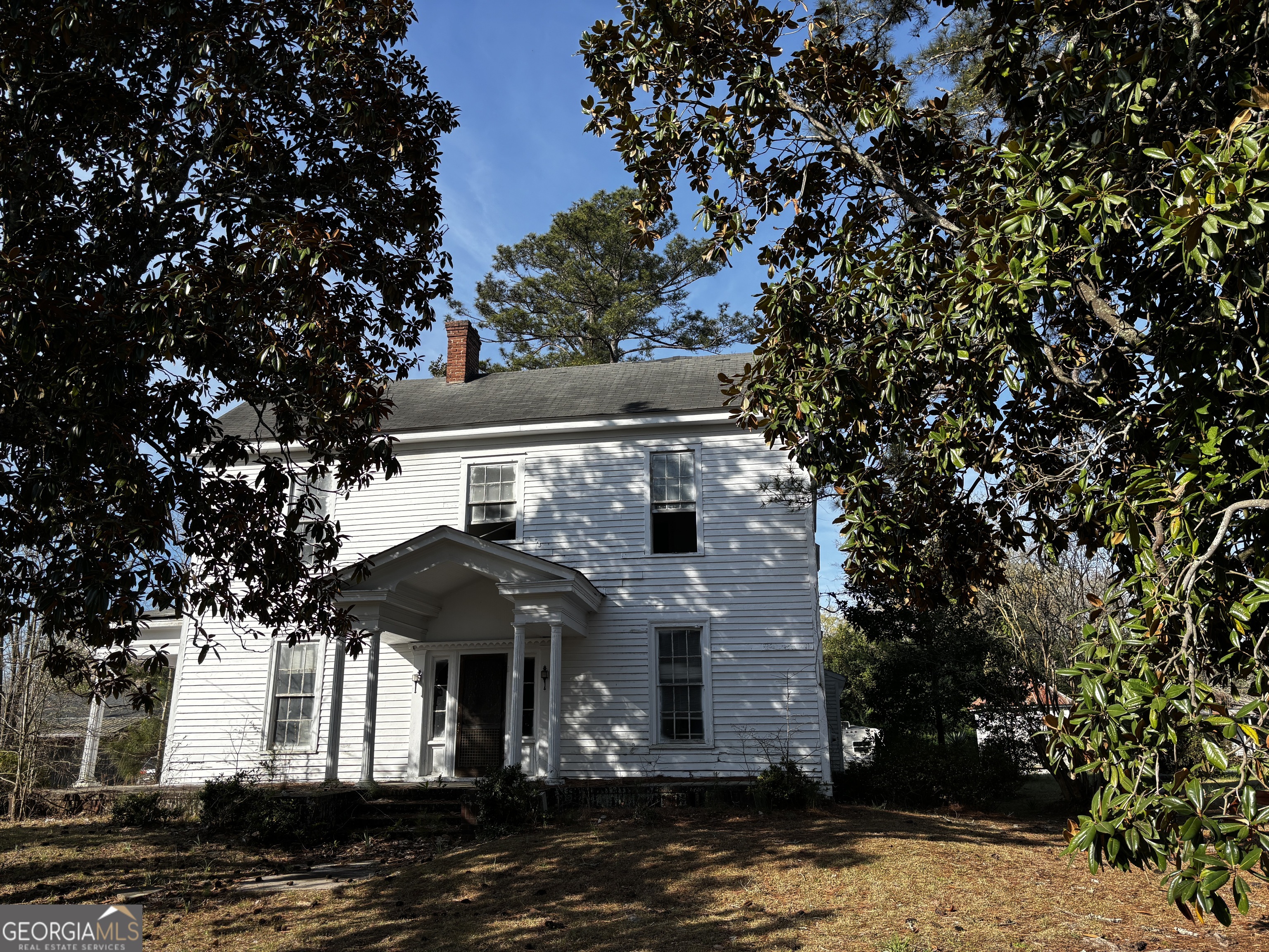 301 Cleveland Street Thomson, GA 30824 - Photo 2 of 17 a front view of a house with a yard