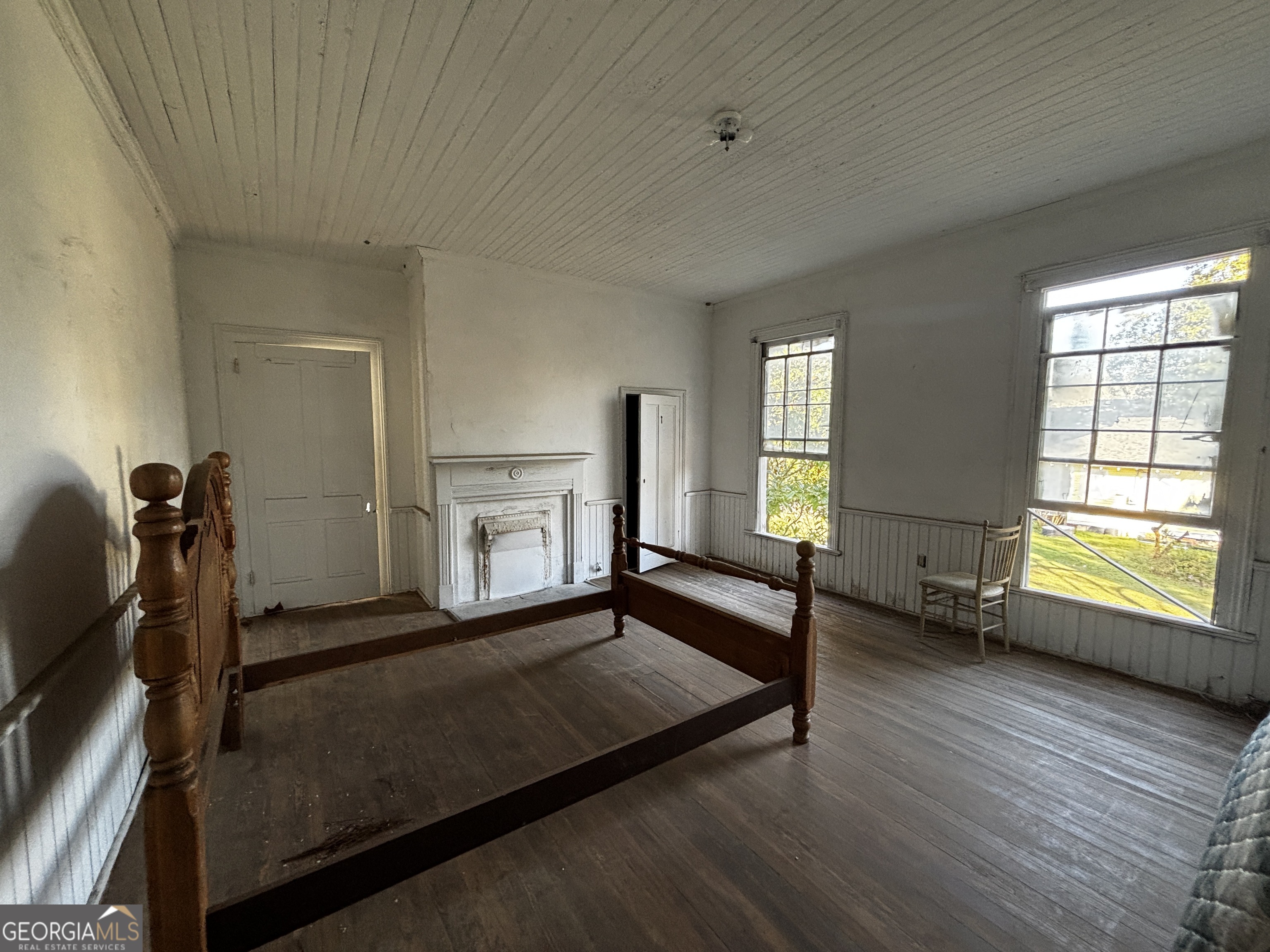 301 Cleveland Street Thomson, GA 30824 - Photo 9 of 17 a view of a livingroom with a fireplace and window