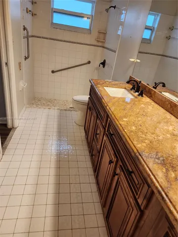 a bathroom with a sink and a shower