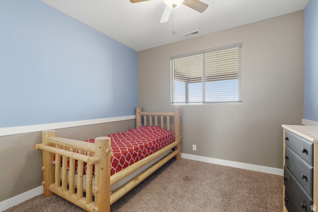 2567 West Rim Rock Drive Stockton, UT 84071 - Photo 31 of 64 Room featuring a neutral wall, light blue accent wall, and a horizontal window with blinds