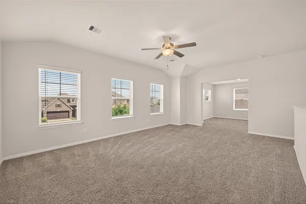a view of empty room with windows