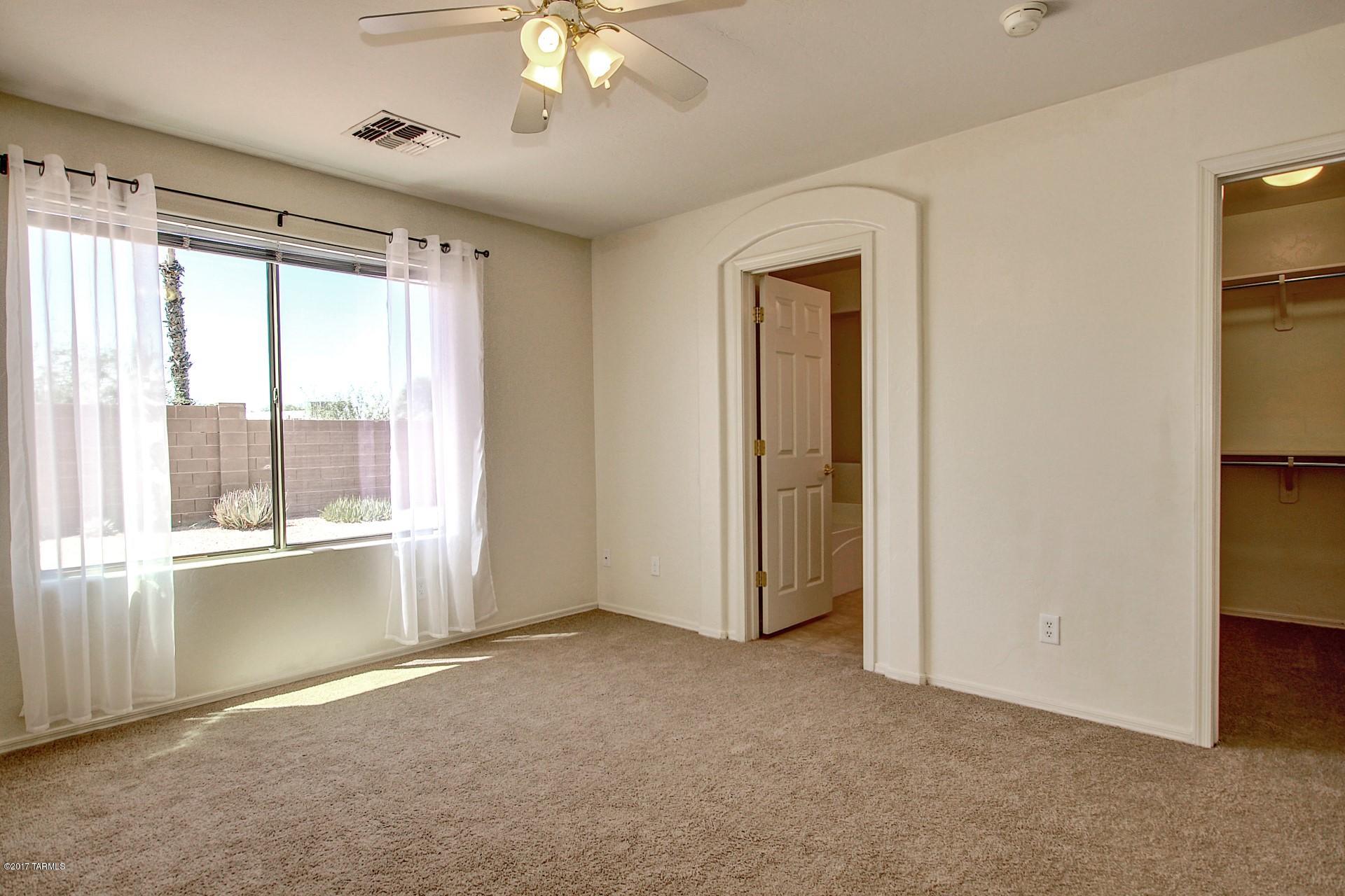 8350 East Bowline Road Tucson, AZ 85710 - Photo 12 of 26 a view of an empty room with a window