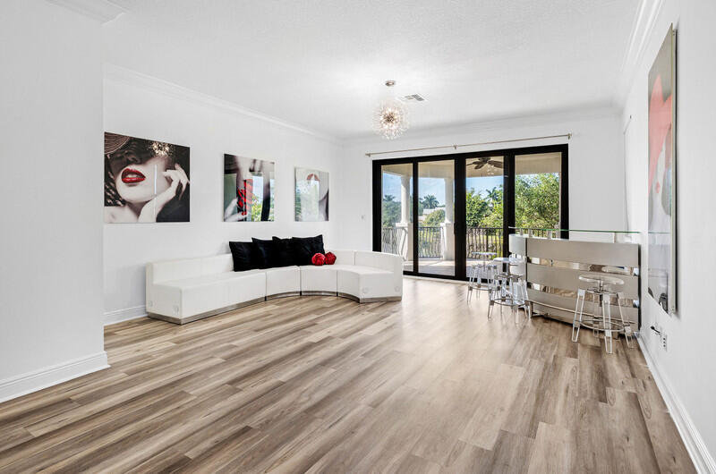 12153 Boca Reserve Lane Boca Raton, FL 33428 - Photo 20 of 35 a living room with furniture and a large window