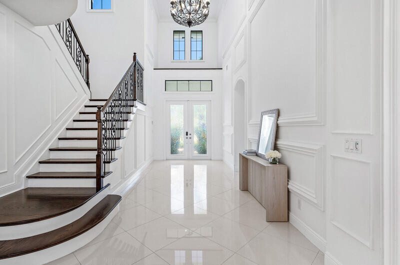 12153 Boca Reserve Lane Boca Raton, FL 33428 - Photo 3 of 35 a view of a kitchen with furniture and staircase