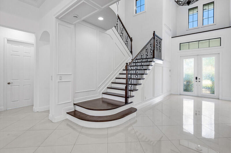12153 Boca Reserve Lane Boca Raton, FL 33428 - Photo 4 of 35 a view of entryway and hall with wooden floor