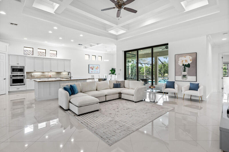 12153 Boca Reserve Lane Boca Raton, FL 33428 - Photo 5 of 35 a living room with furniture and a large window