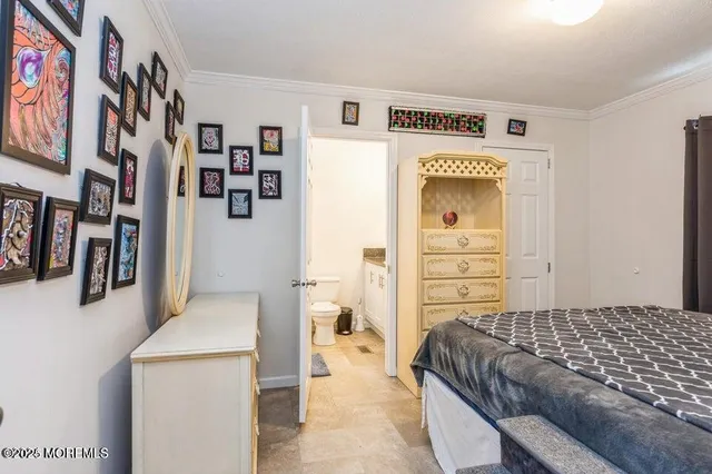 a bedroom with a bed and furniture