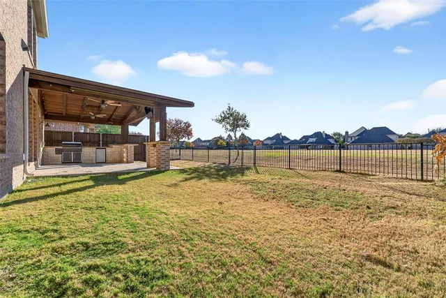 an aerial view of a house with outdoor space