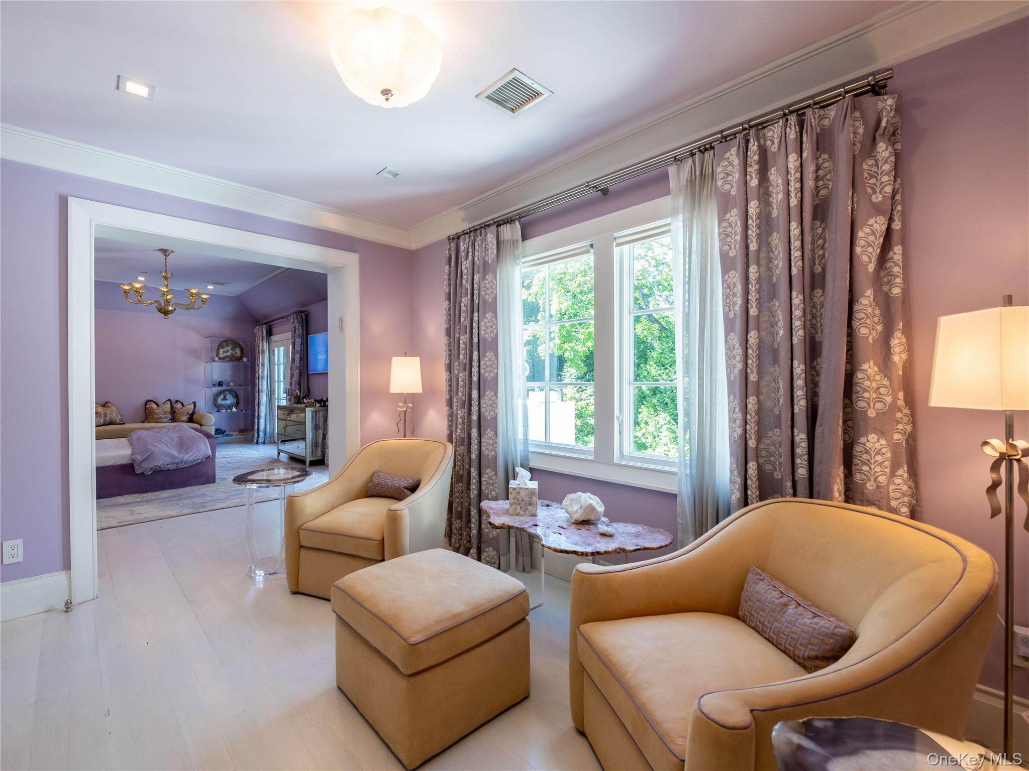 16 Ridge Drive East Great Neck, NY 11021 - Photo 26 of 50 Living area with a chandelier, wood finished floors, and crown molding