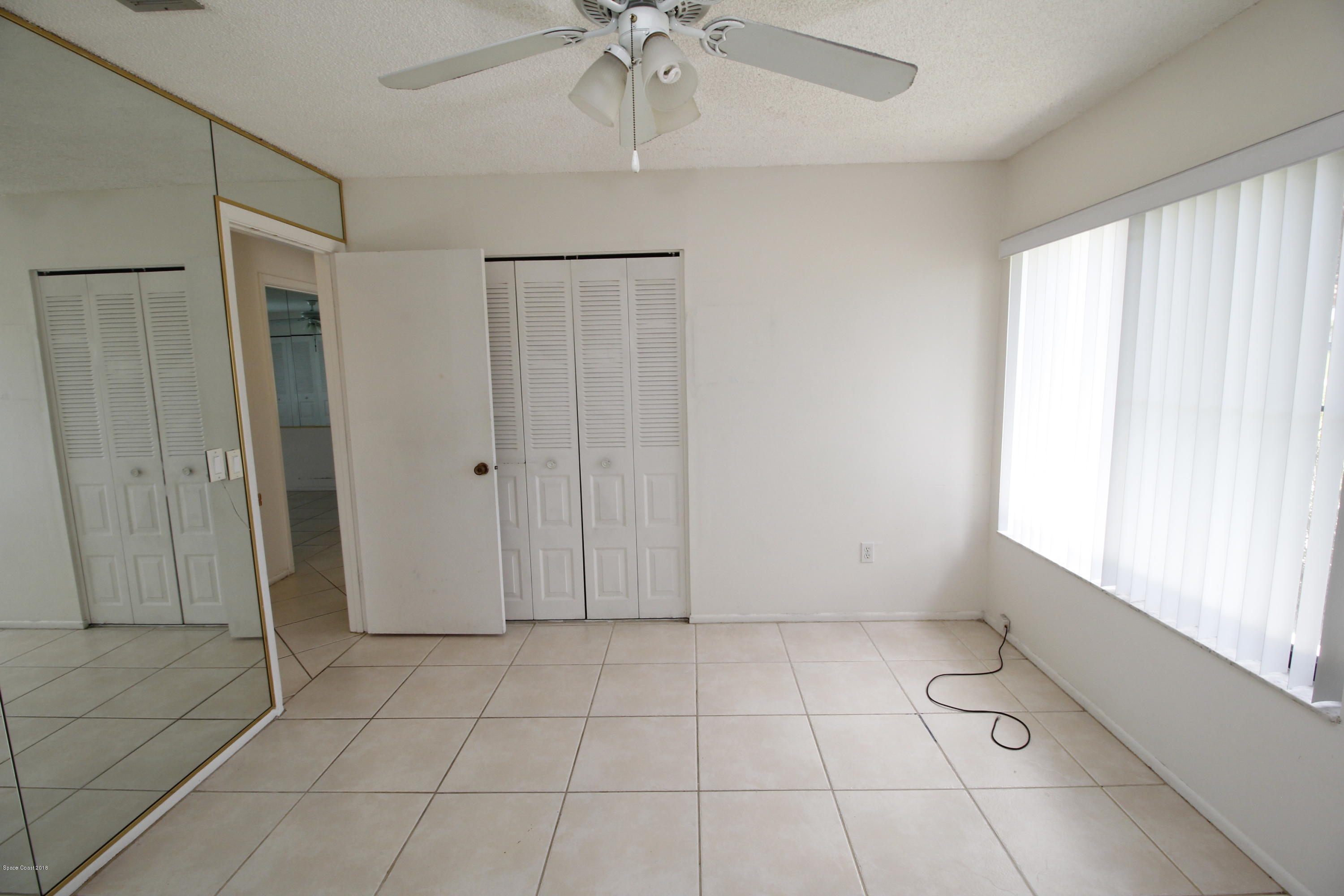 1302 Cherry Hills Road Northeast Palm Bay, FL 32905 - Photo 15 of 24 a view of an empty room with a window