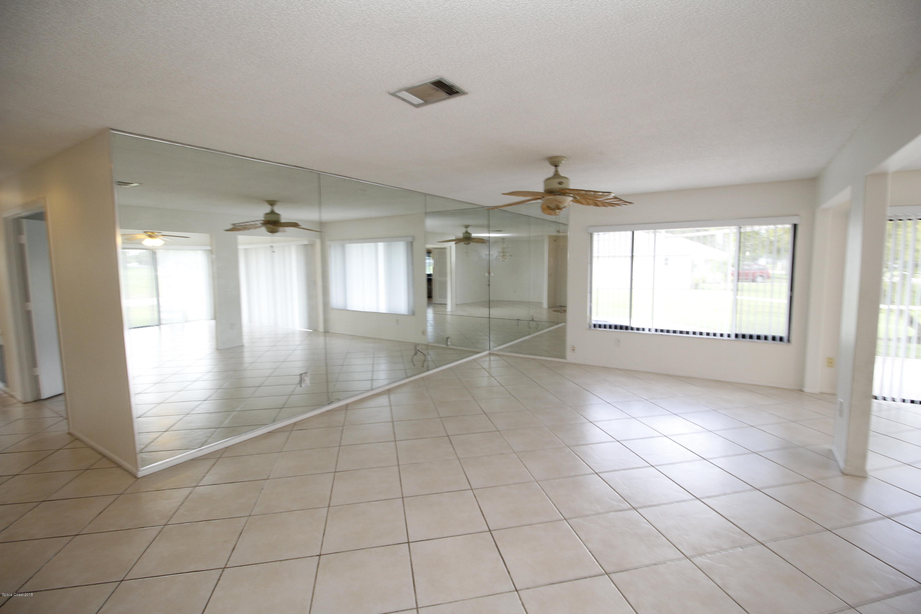 1302 Cherry Hills Road Northeast Palm Bay, FL 32905 - Photo 18 of 24 a view of an empty room and window